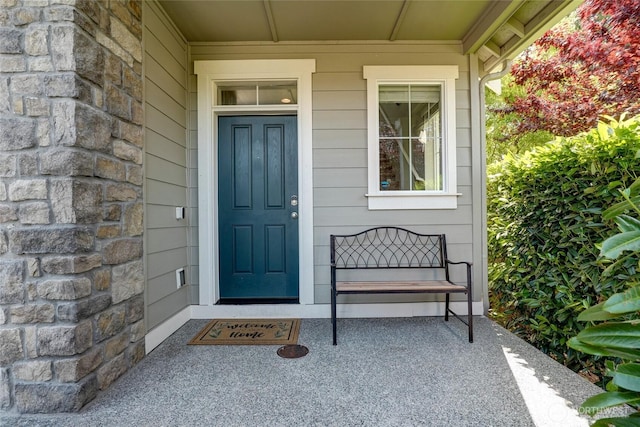 1705 85th Ave SE, Lake Stevens, WA 98258 - view of exterior entry with stone siding and a porch