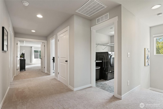 1705 85th Ave SE, Lake Stevens, WA 98258 - hallway with washing machine and clothes dryer, carpet flooring, and recessed lighting