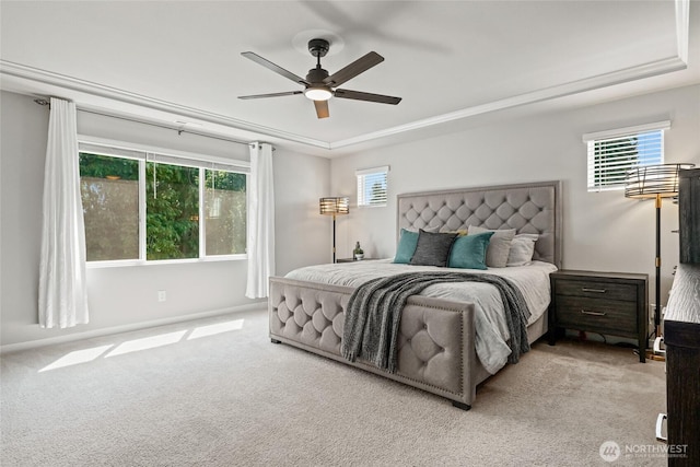 1705 85th Ave SE, Lake Stevens, WA 98258 - bedroom with carpet floors, a tray ceiling, multiple windows, and ceiling fan