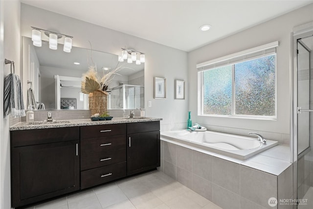 1705 85th Ave SE, Lake Stevens, WA 98258 - bathroom with a shower stall, a bath, double vanity, tile patterned flooring, and recessed lighting