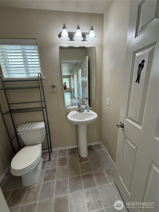 1306 Brackenridge Ave, Dupont, WA 98327 - bathroom with baseboards and toilet
