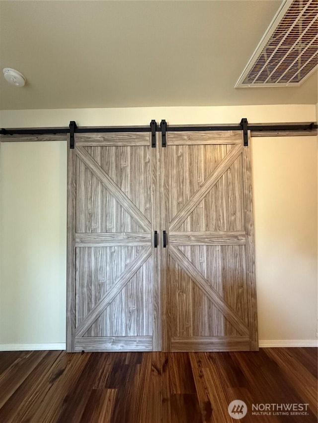 1306 Brackenridge Ave, Dupont, WA 98327 - detailed view of a barn door, a smoke detector, and wood finished floors