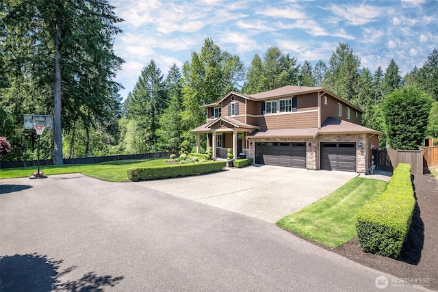 1141 Bell Hill Pl, Dupont, WA 98327 - view of front of property with stone siding, driveway, and a garage