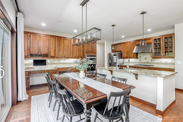 1141 Bell Hill Pl, Dupont, WA 98327 - dining room featuring light wood finished floors and recessed lighting