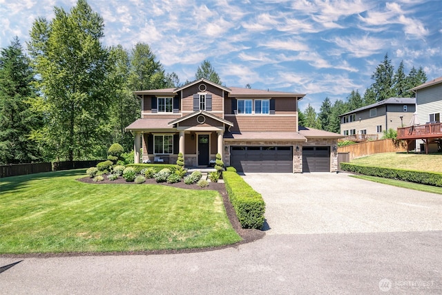1141 Bell Hill Pl, Dupont, WA 98327 - view of front of home with stone siding, concrete driveway, and a garage