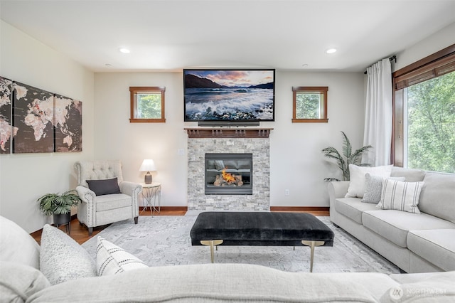 1141 Bell Hill Pl, Dupont, WA 98327 - living room featuring wood finished floors, healthy amount of natural light, a fireplace, and recessed lighting