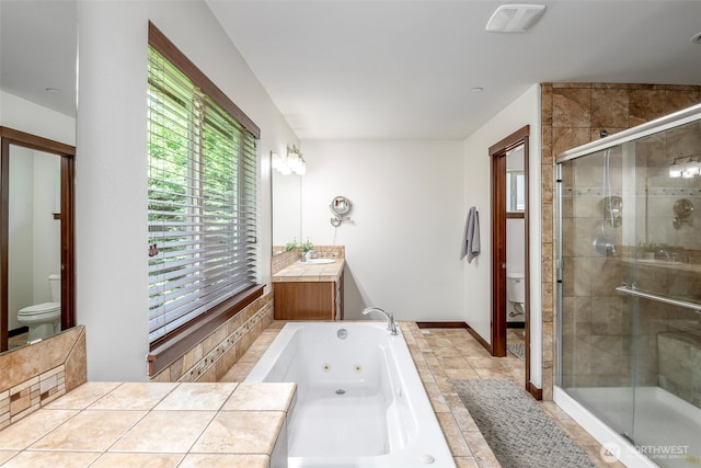 1141 Bell Hill Pl, Dupont, WA 98327 - bathroom featuring a jetted tub, a shower stall, vanity, and plenty of natural light
