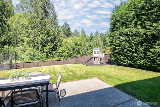 1141 Bell Hill Pl, Dupont, WA 98327 - fenced backyard with a playground, a patio, and outdoor dining area