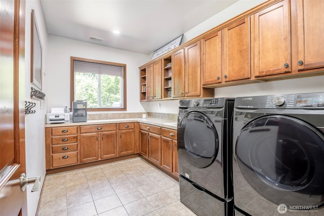 1141 Bell Hill Pl, Dupont, WA 98327 - laundry room with cabinet space, washing machine and dryer, light tile patterned floors, and recessed lighting