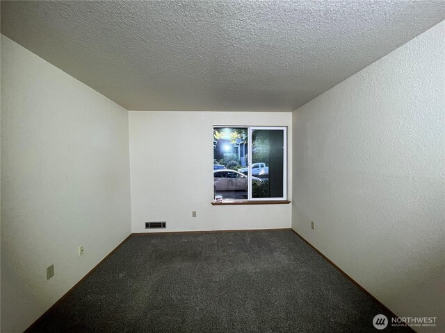 8407 18th Ave W Unit 4-103, Everett, WA 98204 - carpeted spare room featuring a textured ceiling