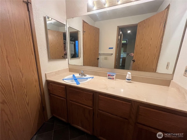 8407 18th Ave W Unit 4-103, Everett, WA 98204 - bathroom featuring vanity, tile patterned flooring, and a textured wall