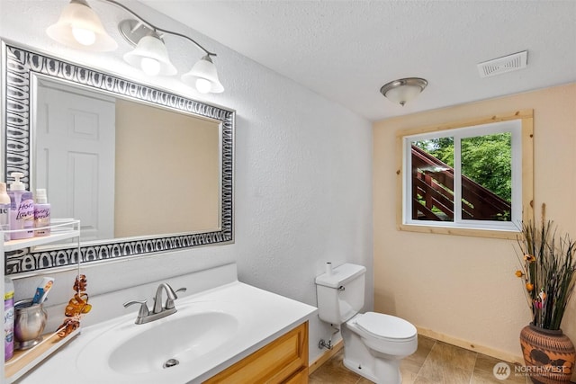 508 Ocean Beach Rd, Hoquiam, WA 98550 - half bathroom featuring vanity, a textured wall, and a textured ceiling