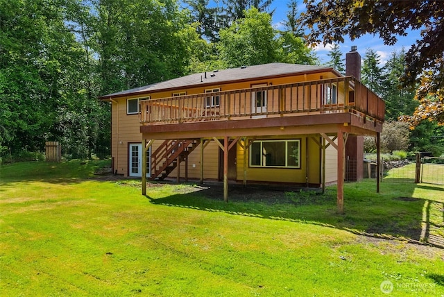 508 Ocean Beach Rd, Hoquiam, WA 98550 - back of property featuring a chimney, a wooden deck, and stairs