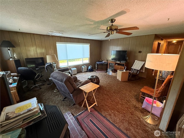 5645 Lento Pl SE, Olympia, WA 98513 - living room with carpet floors, wood walls, a textured ceiling, an office area, and a ceiling fan