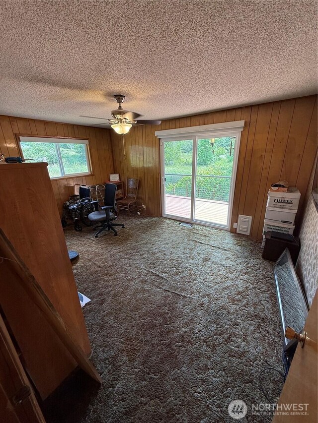 5645 Lento Pl SE, Olympia, WA 98513 - home office with carpet, a textured ceiling, wooden walls, and ceiling fan