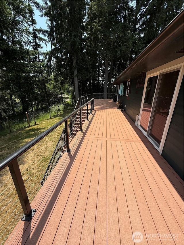 5645 Lento Pl SE, Olympia, WA 98513 - wooden terrace featuring a yard and view of wooded area