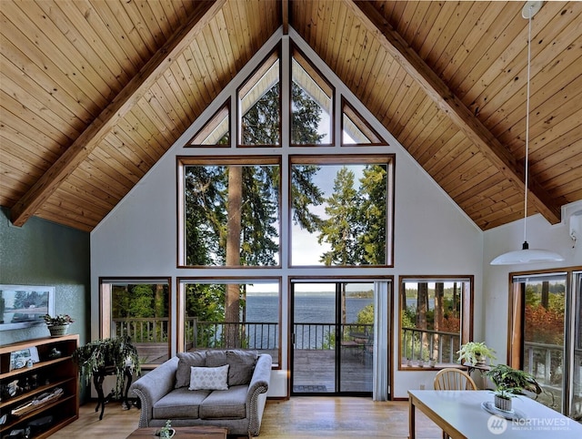 662 E Stadium Beach Rd E, Grapeview, WA 98546 - living room with high vaulted ceiling, a wood ceiling with exposed beams, a water view, and light wood finished floors