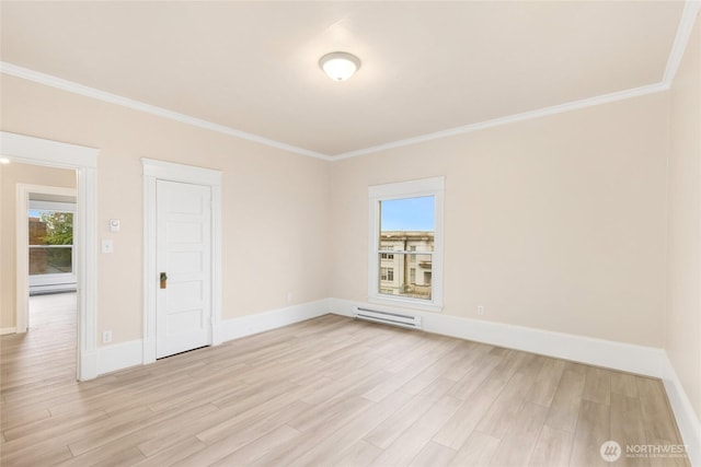 3722 Oakes Ave, Everett, WA 98201 - spare room featuring light wood-style flooring, crown molding, and baseboard heating
