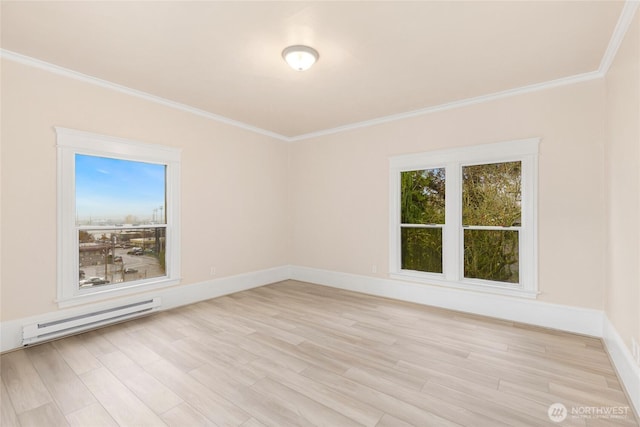 3722 Oakes Ave, Everett, WA 98201 - unfurnished room featuring a baseboard radiator, ornamental molding, and light wood-style flooring