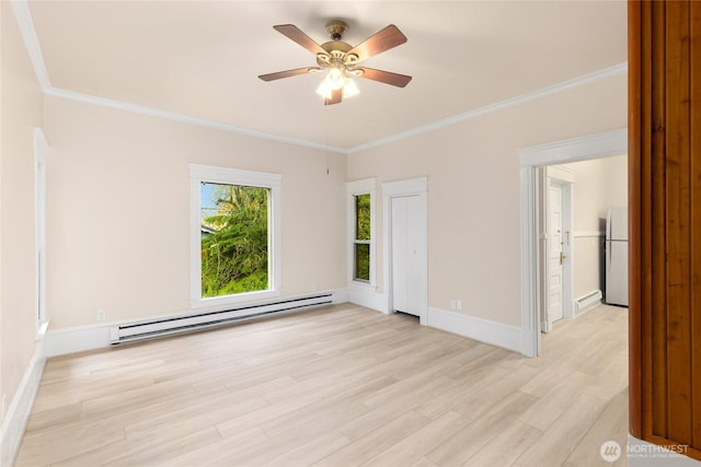 3722 Oakes Ave, Everett, WA 98201 - spare room with baseboard heating, light wood-type flooring, a ceiling fan, and crown molding