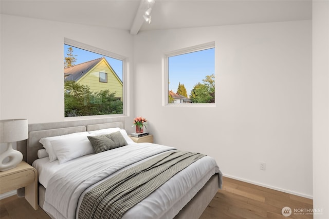 926 23rd Ave, Seattle, WA 98122 - bedroom featuring wood finished floors, lofted ceiling, and rail lighting