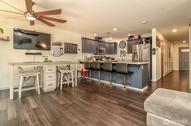 6530 Newaukum Pl NE, Bremerton, WA 98311 - kitchen with stainless steel microwave, ceiling fan, dark wood-type flooring, a peninsula, and recessed lighting
