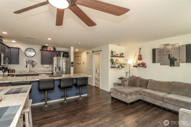 6530 Newaukum Pl NE, Bremerton, WA 98311 - living room with a barn door, dark wood finished floors, a ceiling fan, and recessed lighting