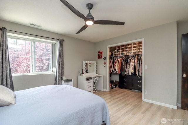 6530 Newaukum Pl NE, Bremerton, WA 98311 - bedroom featuring light wood finished floors, a closet, ceiling fan, and a spacious closet