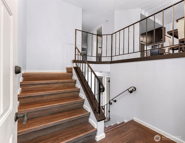 1211 N 8th St Unit 2, Mount Vernon, WA 98273 - staircase featuring wood finished floors