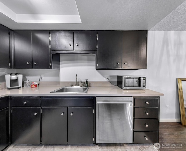 1211 N 8th St Unit 2, Mount Vernon, WA 98273 - kitchen with appliances with stainless steel finishes, light countertops, light wood finished floors, and a textured ceiling