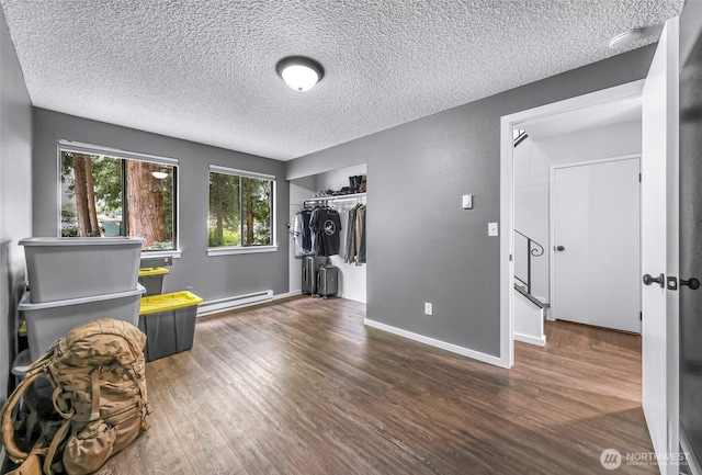 1211 N 8th St Unit 2, Mount Vernon, WA 98273 - sitting room featuring a baseboard radiator, a textured ceiling, and wood finished floors
