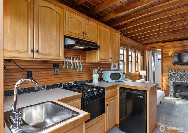 2401 N Northlake Way Unit E7, Seattle, WA 98103 - kitchen with black appliances, under cabinet range hood, a wooden ceiling with exposed beams, a peninsula, and wood walls