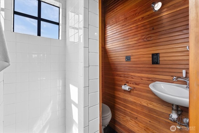 2401 N Northlake Way Unit E7, Seattle, WA 98103 - bathroom featuring toilet and wooden walls