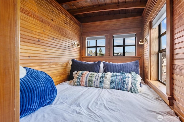 2401 N Northlake Way Unit E7, Seattle, WA 98103 - bedroom featuring wooden walls, a wooden ceiling with exposed beams, and multiple windows