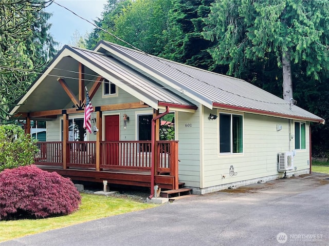 601 Mountain Trail Rd, Brinnon, WA 98320 - view of front of home featuring covered porch and a metal roof
