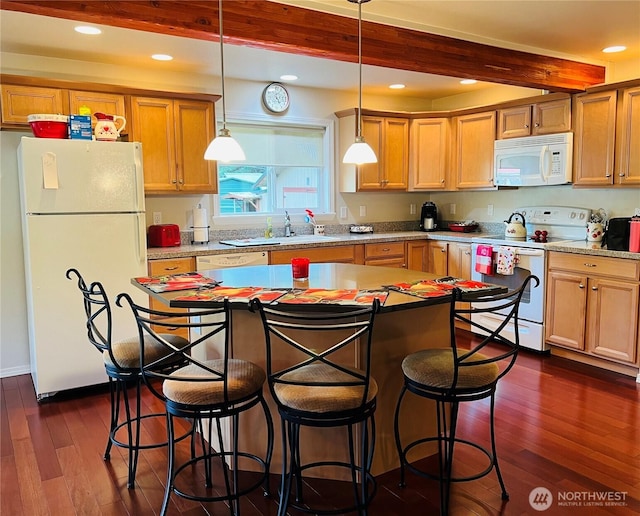 601 Mountain Trail Rd, Brinnon, WA 98320 - kitchen featuring white appliances, beam ceiling, dark wood finished floors, decorative light fixtures, and a kitchen breakfast bar