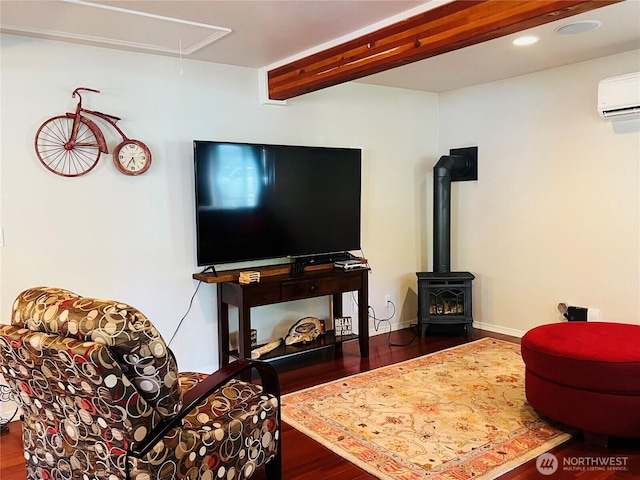 601 Mountain Trail Rd, Brinnon, WA 98320 - living room with an AC wall unit, attic access, wood finished floors, a wood stove, and recessed lighting
