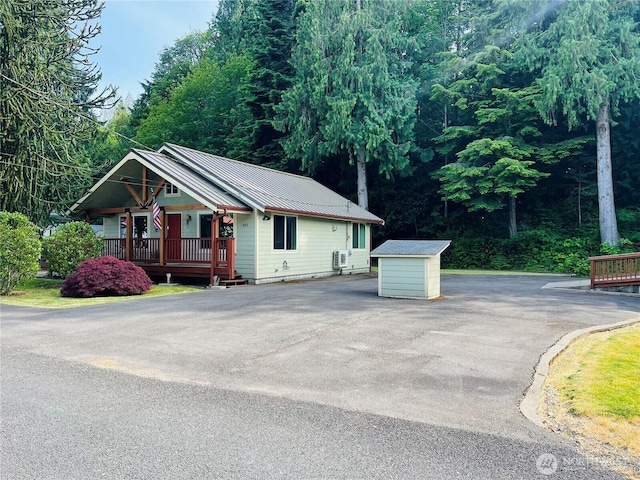 601 Mountain Trail Rd, Brinnon, WA 98320 - view of front facade featuring a porch and a metal roof