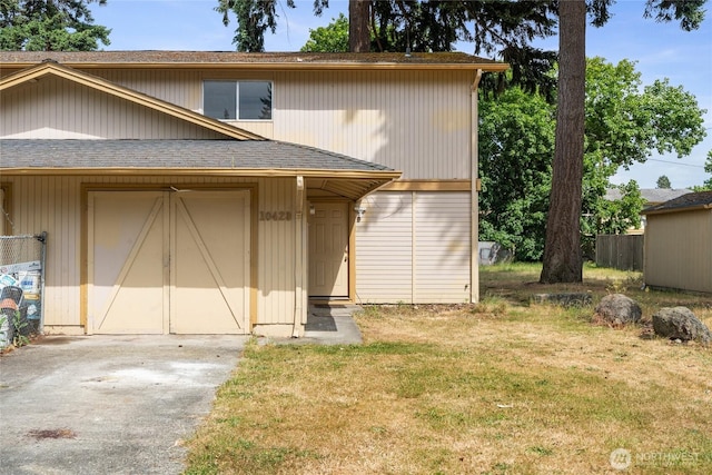 10423 13th Avenue Ct S, Tacoma, WA 98444 - view of front of house featuring a front lawn and a shingled roof