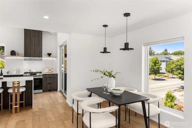 930 23rd Ave, Seattle, WA 98122 - kitchen with stainless steel range with gas cooktop, open shelves, modern cabinets, light wood-style floors, and recessed lighting