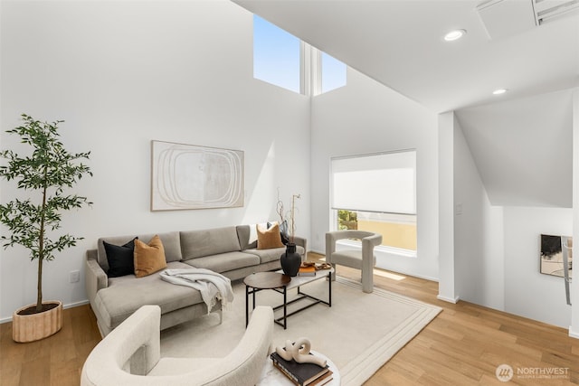 930 23rd Ave, Seattle, WA 98122 - living area featuring light wood-style flooring, recessed lighting, and high vaulted ceiling