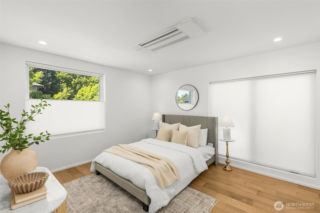 930 23rd Ave, Seattle, WA 98122 - bedroom with multiple windows, light wood-style flooring, and recessed lighting