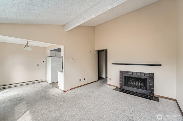 4802 S 187th Pl Unit A305, Seatac, WA 98188 - unfurnished living room with baseboard heating, carpet flooring, a tiled fireplace, and a textured ceiling