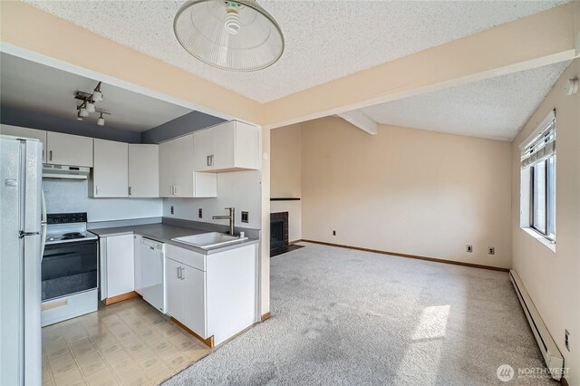 4802 S 187th Pl Unit A305, Seatac, WA 98188 - kitchen featuring white appliances, a baseboard radiator, under cabinet range hood, a textured ceiling, and white cabinets