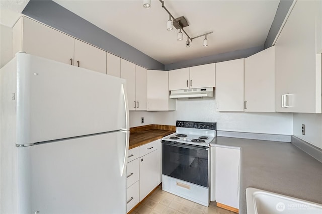 4802 S 187th Pl Unit A305, Seatac, WA 98188 - kitchen with white appliances, under cabinet range hood, and white cabinets