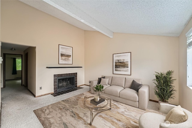 4802 S 187th Pl Unit A305, Seatac, WA 98188 - carpeted living area featuring a textured ceiling, healthy amount of natural light, and a tiled fireplace