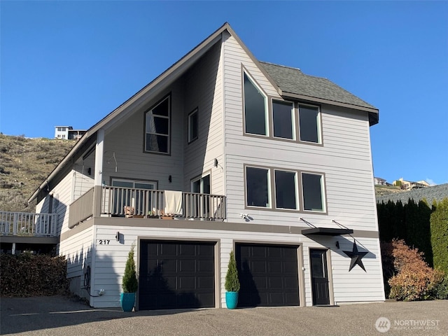 217 San Remo Ln, Chelan, WA 98816 - rear view of property with a garage and a balcony