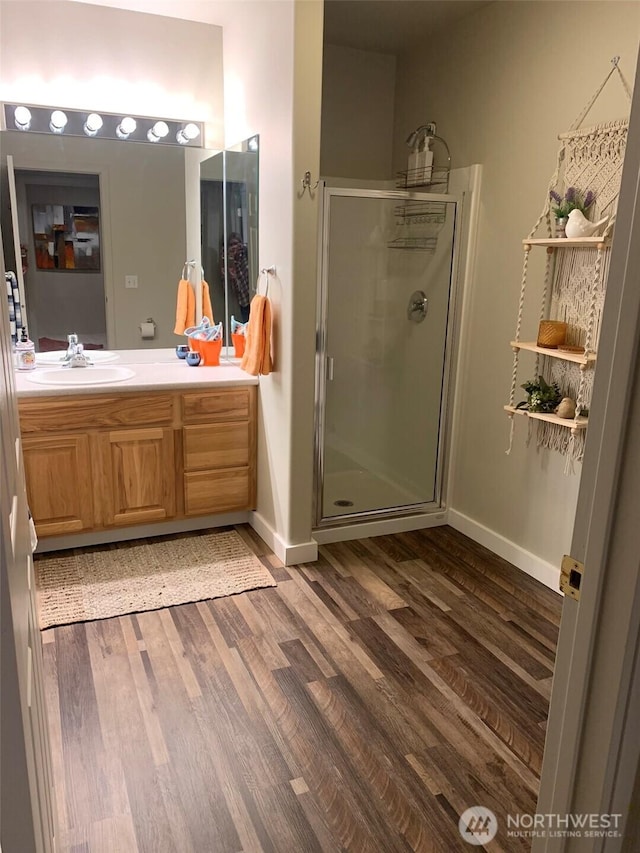 217 San Remo Ln, Chelan, WA 98816 - full bath with wood finished floors, a shower stall, and vanity