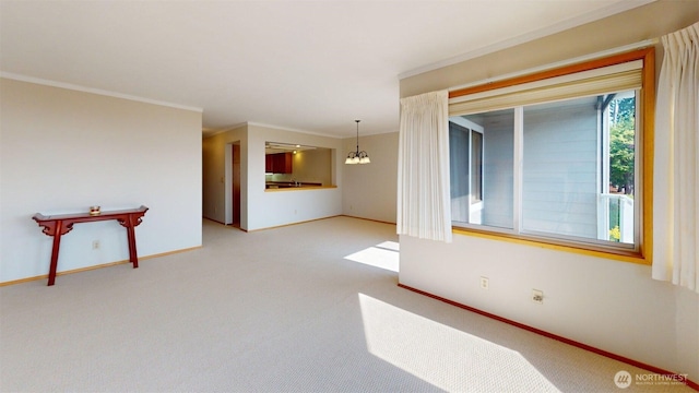 424 14th St # 202, Bellingham, WA 98225 - empty room featuring a chandelier, crown molding, and light carpet