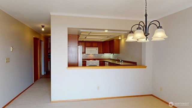 424 14th St # 202, Bellingham, WA 98225 - kitchen featuring white appliances, light colored carpet, backsplash, and decorative light fixtures